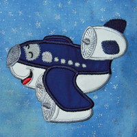 Machine applique design of a smiling blue and white airplane. Great for  children of all ages.  Detailed pattern fills in engine areas.
